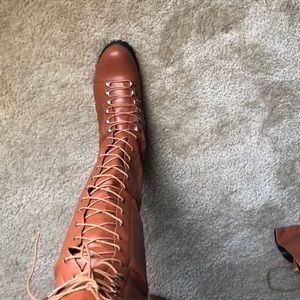 Cognac thigh high boots.